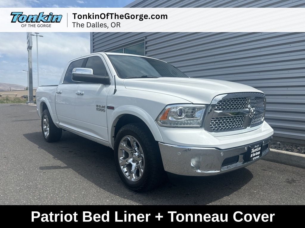 2017 RAM 1500 Laramie in Bright White Clearcoat — front three-quarter view
