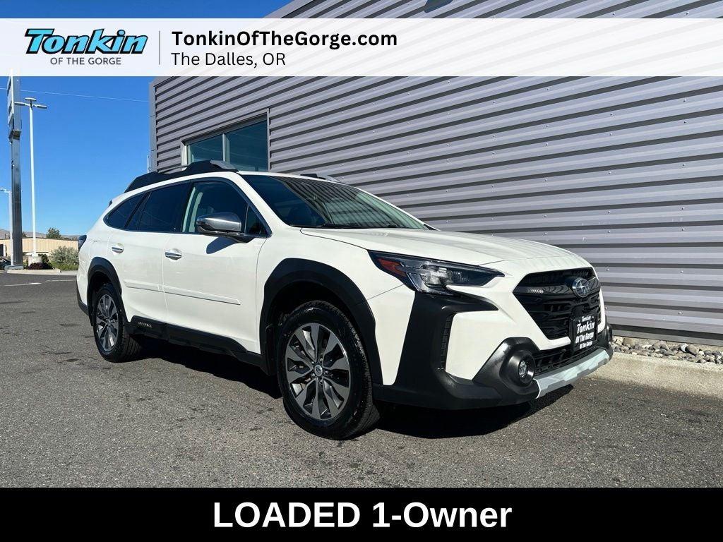 2023 Subaru Outback Touring in Crystal White Pearl — front three-quarter view